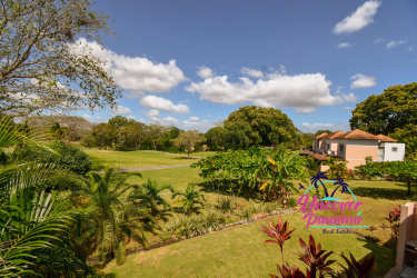 Spacious balcony with terracotta floor white railing overlooking tropical garden Costa Blanca Panama