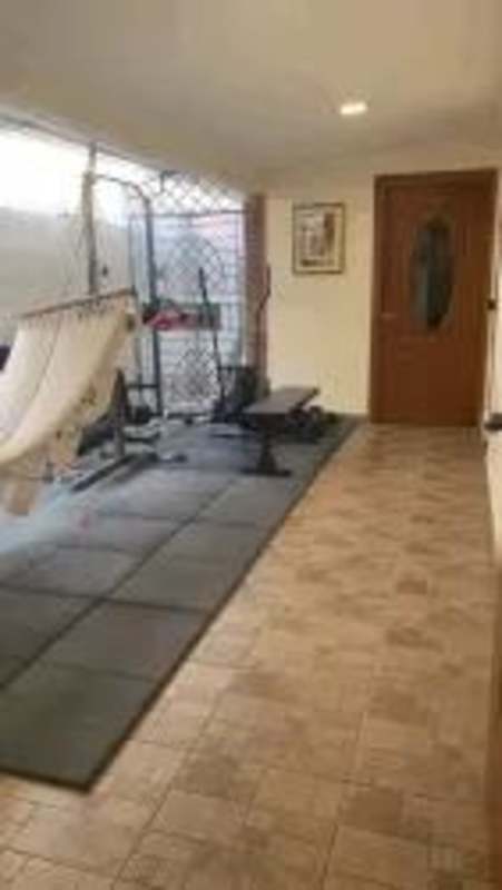 Master bedroom with wood flooring, walk-in closet, balcony terrace in house Nuevo Reparto Chanis Panama City