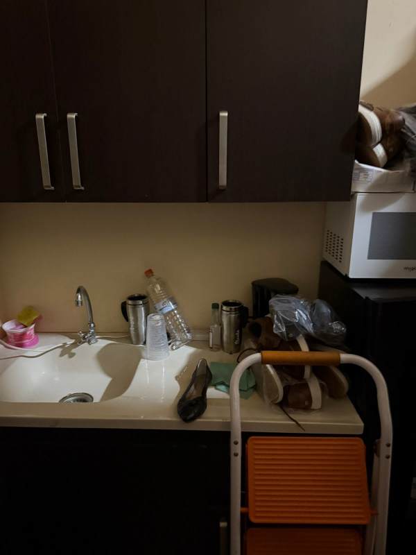 Small kitchenette with sink, cabinets, microwave in retail commercial space Albrook Mall Panama