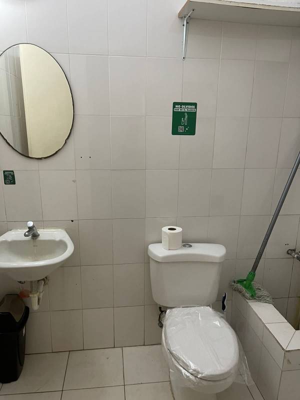 Basic bathroom with sink and toilet inside mall commercial space Albrook Panama