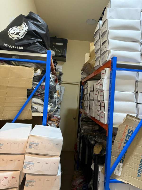 Interior storage room with shelving and boxes at commercial space Albrook Mall Panama