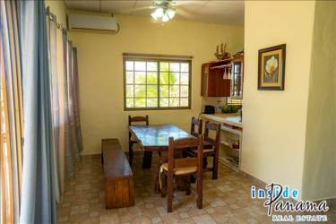 Bright living room with large window, sofa set at Costa Esmeralda San Carlos beach home