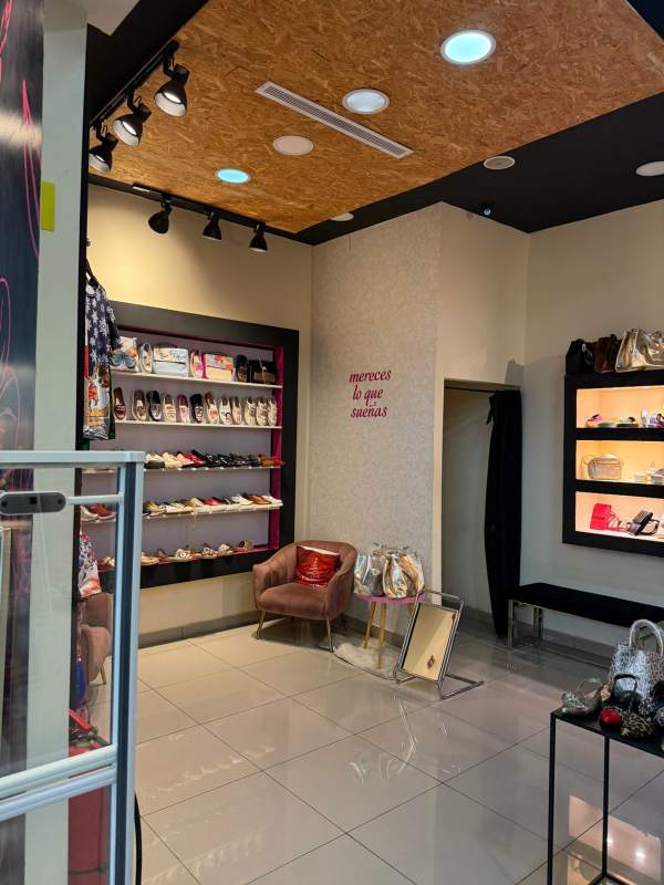 Store interior with display shelves lighting seating in Albrook Mall Panama retail space for rent