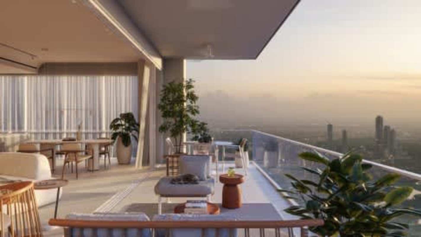 Modern outdoor lounge space with fire pit vertical wood panels and greenery BIOMA Costa del Este Panama