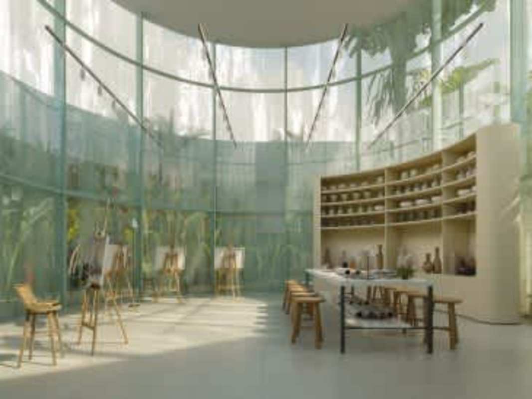 Artist studio with curved glass windows pottery shelves work tables BIOMA Tower Panama City