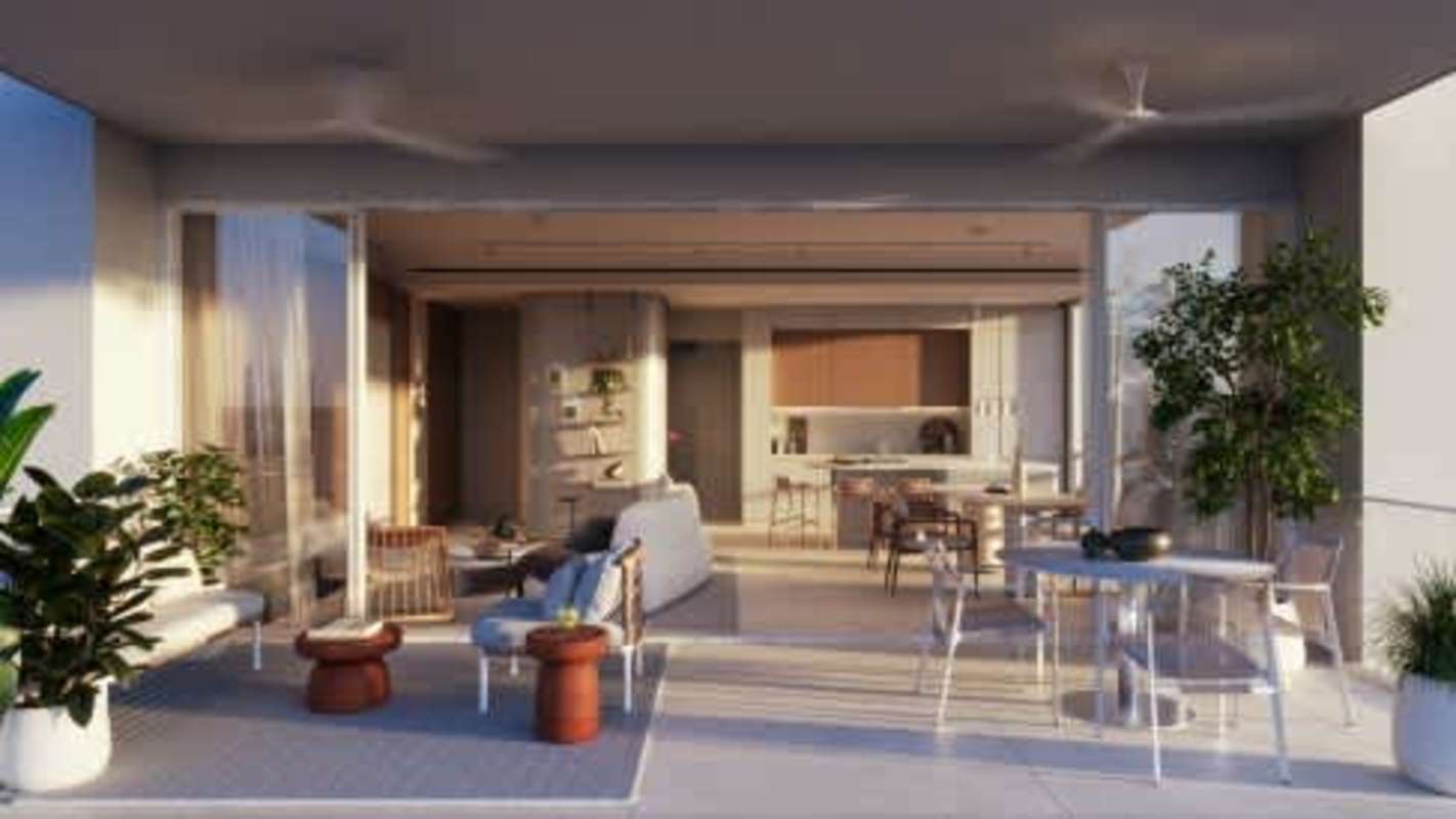 Expansive terrace with large glass doors kitchen living room in luxury BIOMA apartment Panama