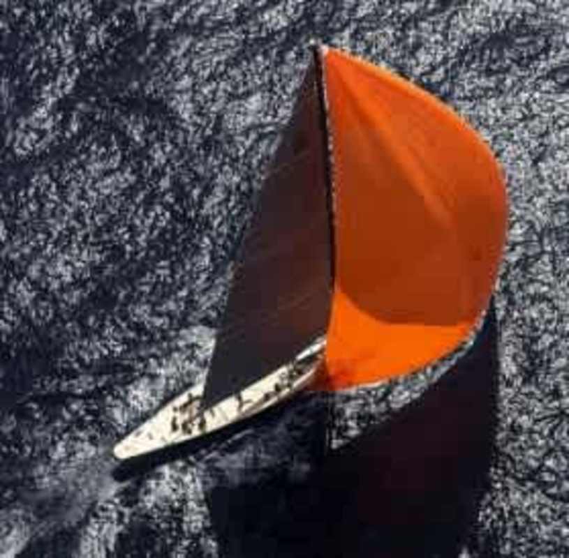 Sailboat with orange sail near marina entrance Amador Panama at Cavarosa Residences
