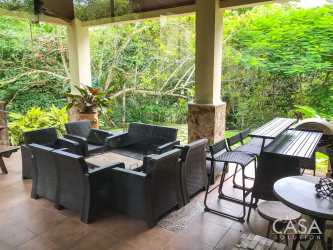 Bar counter, sitting area surrounded by tropical greenery Penonomé Panama