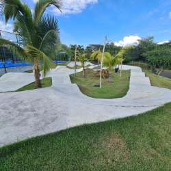 Laundry area with stacked washer dryer and connected maid's room at Punta Caelo