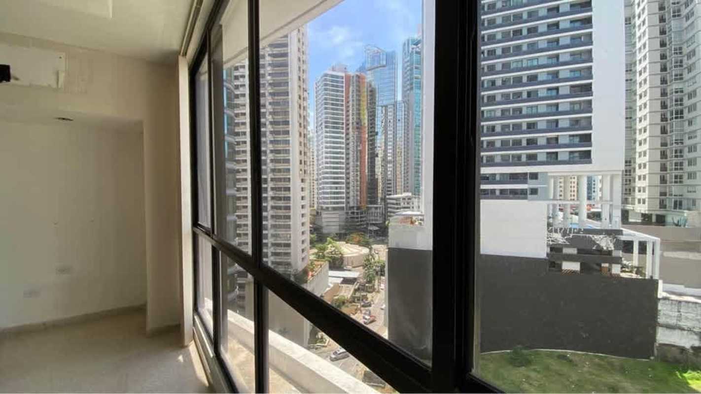 Expansive unfurnished living room with tile floor and large window city views in PH Mar de Plata Punta Paitilla Panama