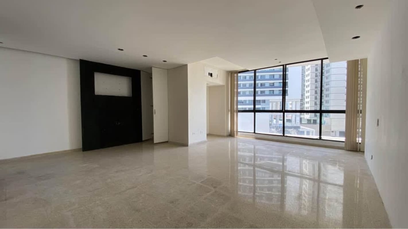 Spacious living room with panoramic ocean and city views floor-to-ceiling windows PH Mar de Plata Panama