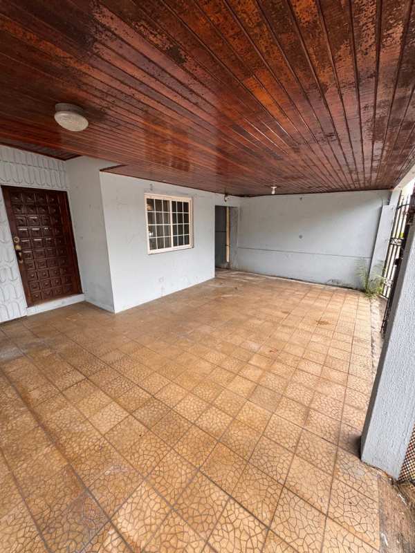 Side access corridor with iron fencing and concrete floor at Residencial San Antonio Panama