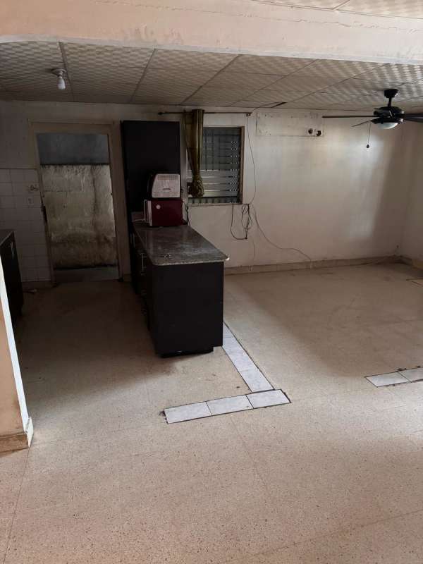 Basic kitchen with granite countertop and breakfast bar at affordable house San Antonio Panama