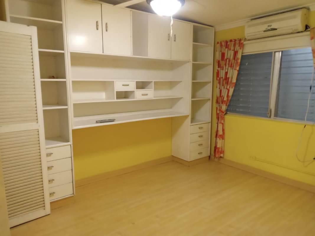 Modern bathroom with black bathtub double sink and glass shower in Villa de las Fuentes Panama