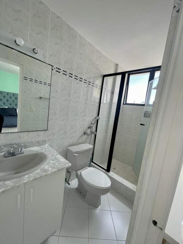 Bright open living dining space with balcony and skyline view in PH Fontana