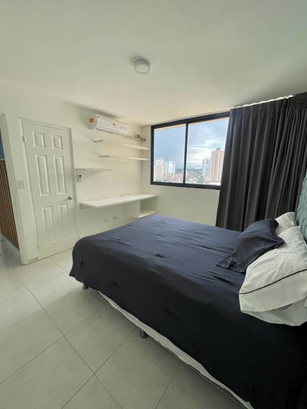 Fully equipped modern kitchen with appliances and dining bar at PH Fontana Obarrio