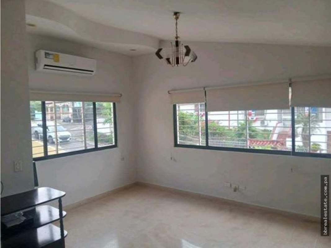 Bedroom with wood laminate flooring, recessed lights, white walls, Betania Club X rental house Panama City