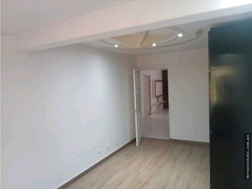 Large bright living room with marble tiles, big windows, ceiling chandelier, Betania Club X house rental Panama