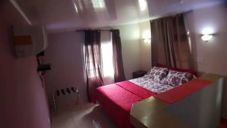 Living space combined with rustic kitchen features and dining set Vista Alegre Panama