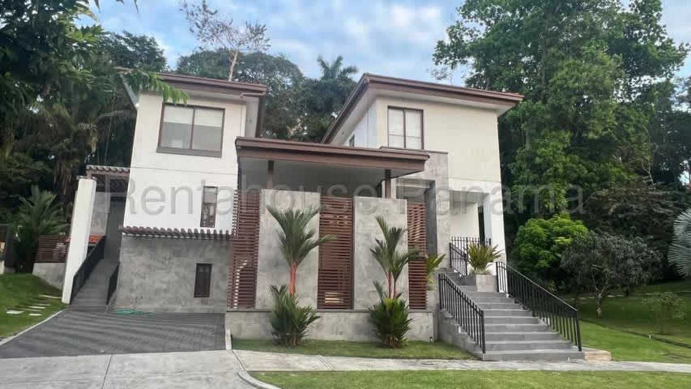 Exterior of 4BR modern house with large windows and landscaped garden in Clayton gated community Panama