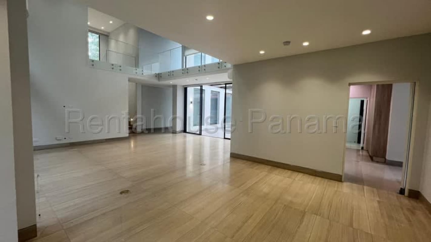 Spacious kitchen featuring island with marble countertop, sleek cabinetry and modern appliances Clayton luxury house
