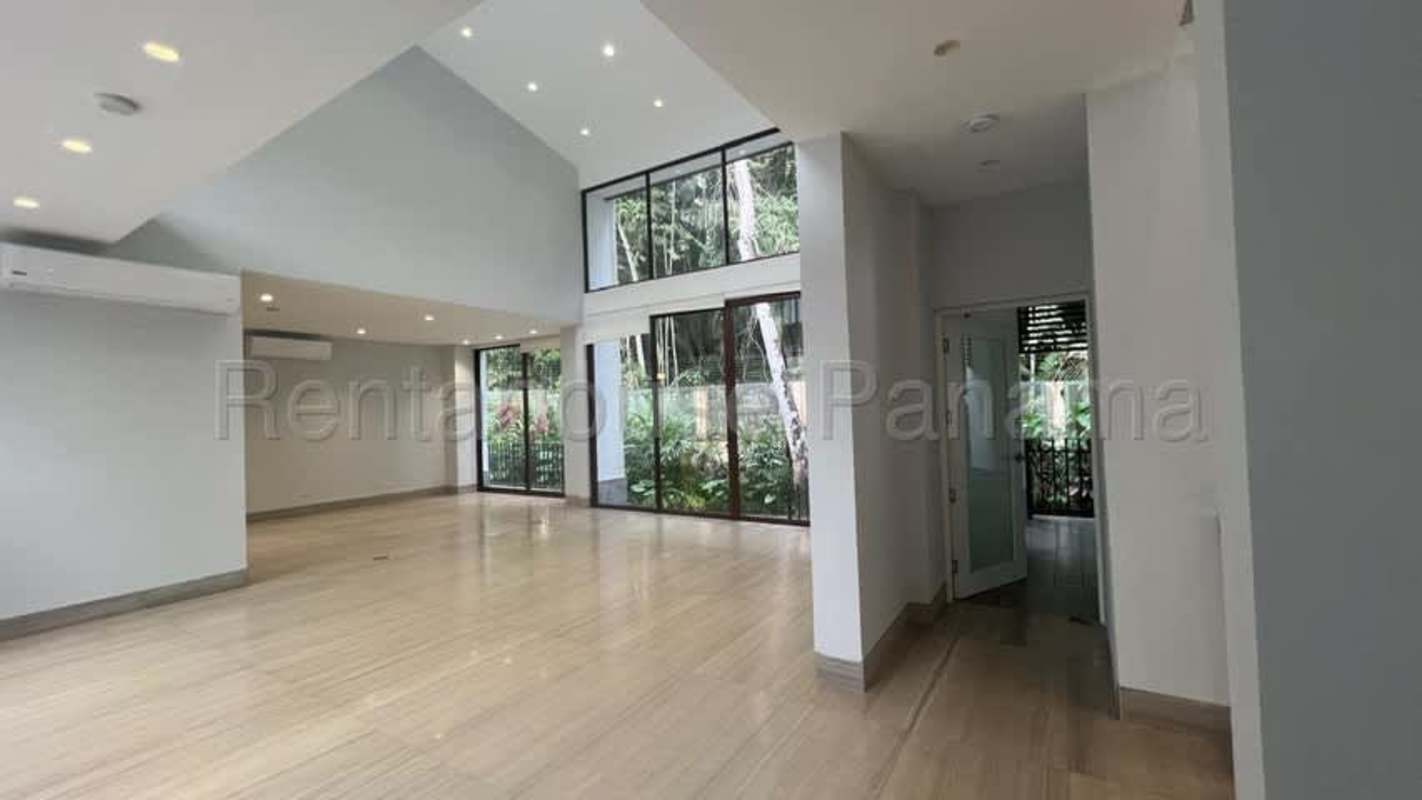 Open modern hallway with glass railings and marble floors in luxury property Clayton Panama