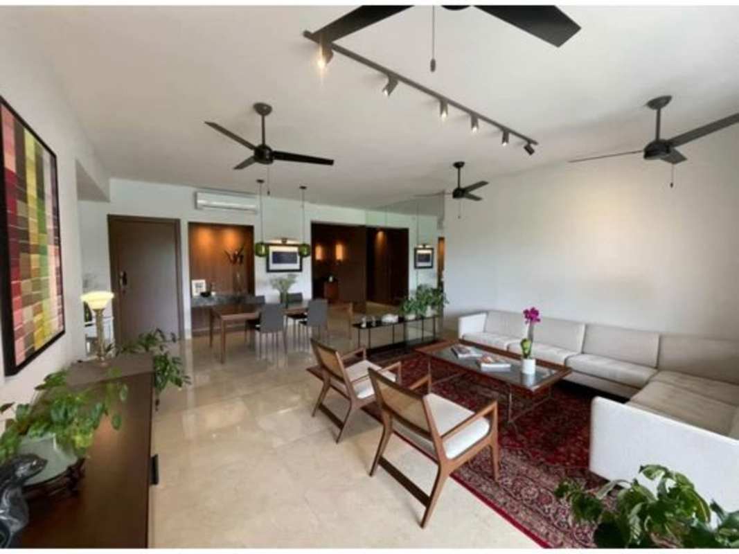 Elegant living room with marble floors, sectional sofa, ceiling fan in PH The Reserve Santa María