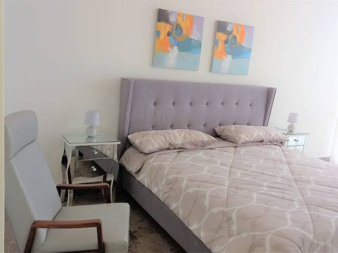 Master bedroom floor to ceiling window ocean city view PH Vista Marina Panama City