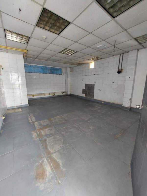 Utility corner with yellow gas pipes and white tiled wall in Juan Díaz Panama commercial rental