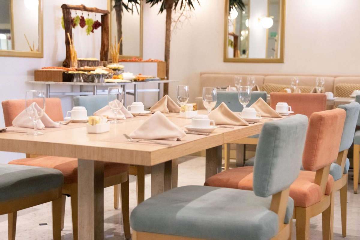 Elegant restaurant dining setup inside Waldorf Astoria Panama Marbella