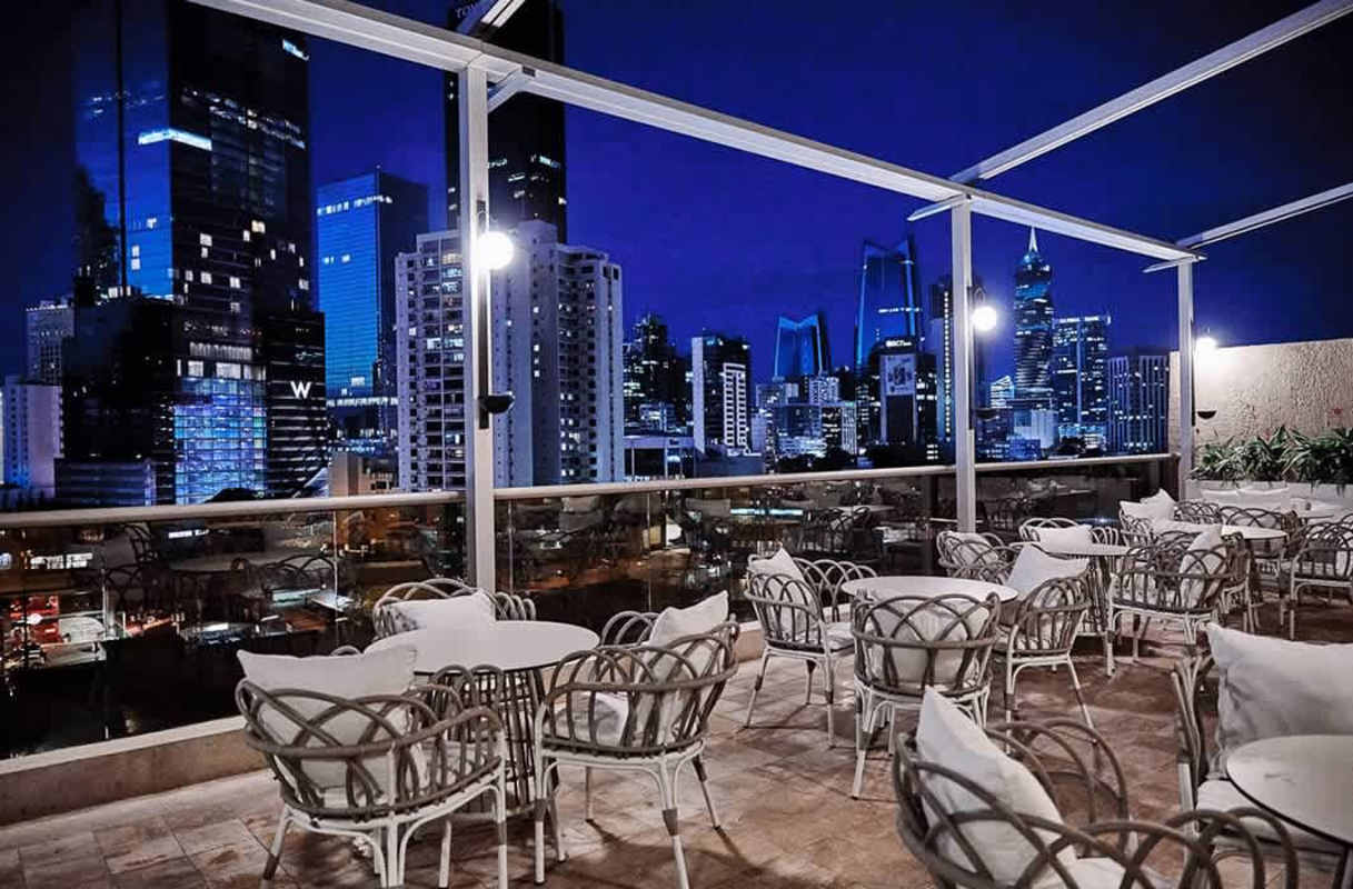 Night skyline view from infinity pool on rooftop of Waldorf Astoria Panama Marbella