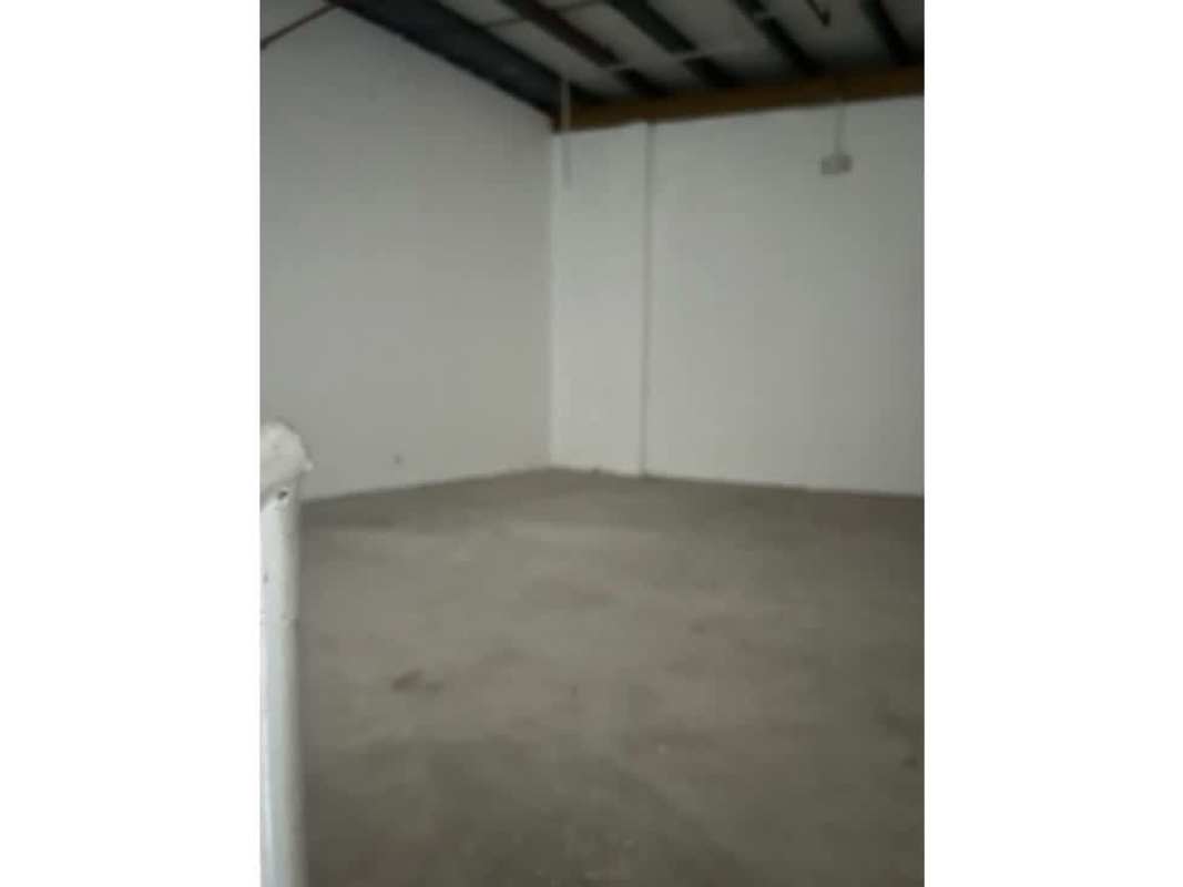 Unfinished utility room with exposed ceiling and small window at warehouse 24 de Diciembre Panama