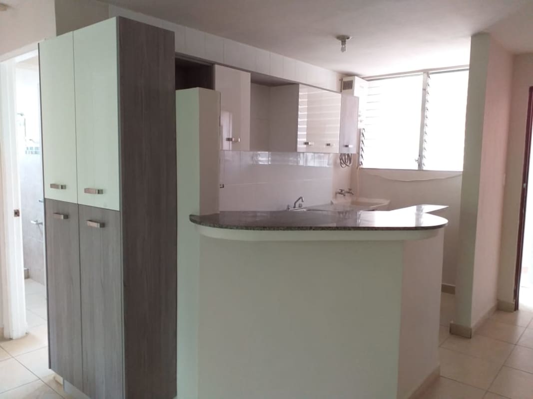 Contemporary kitchen with breakfast bar granite countertop in PH Bella Vista Gardens Panama City