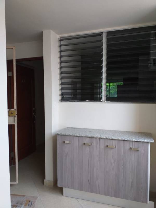 Modern bathroom with walk-in shower, pedestal sink, tiled walls in PH Bella Vista Gardens Panama City