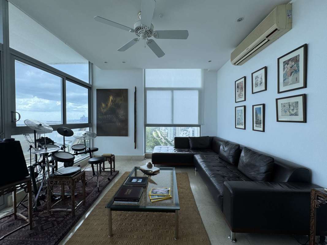 Modern condo living black sofa drum kit large windows PH Ten Tower Panama