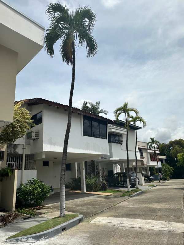 Large dining and living space with wood ceiling and windows luxury house Altos de Golf Panama