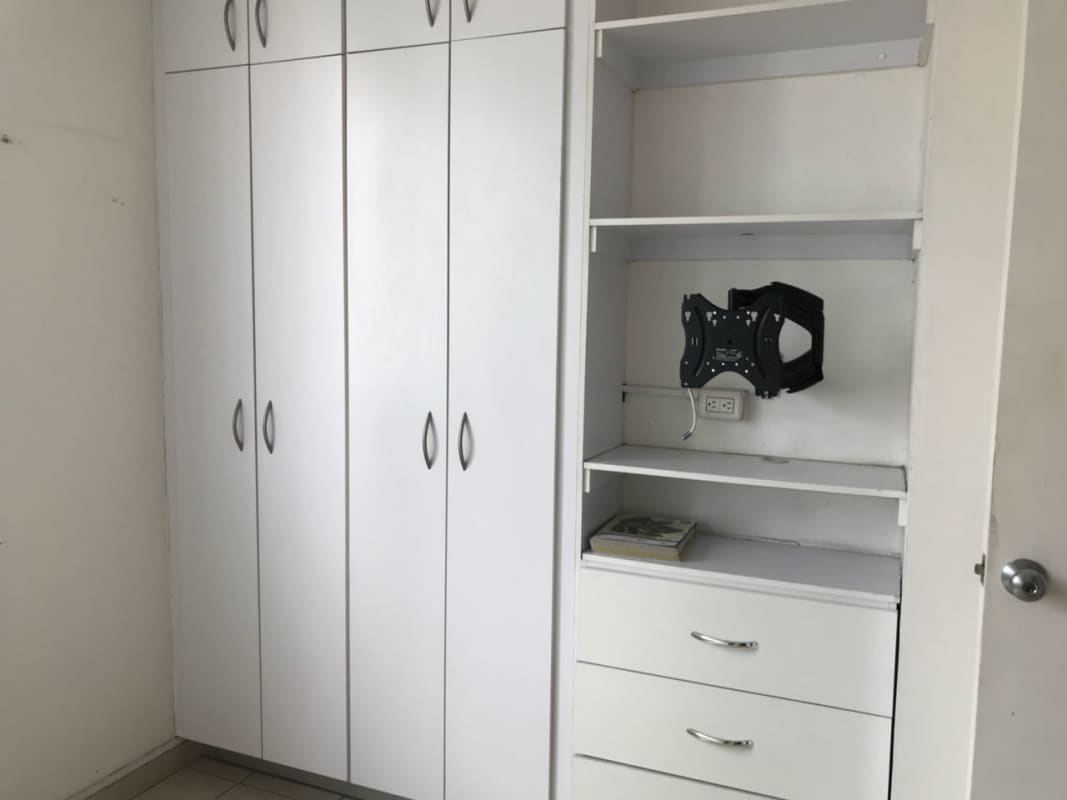 Wardrobe with shelves and TV mount in bedroom PH El Cangrejo Park View Panama City