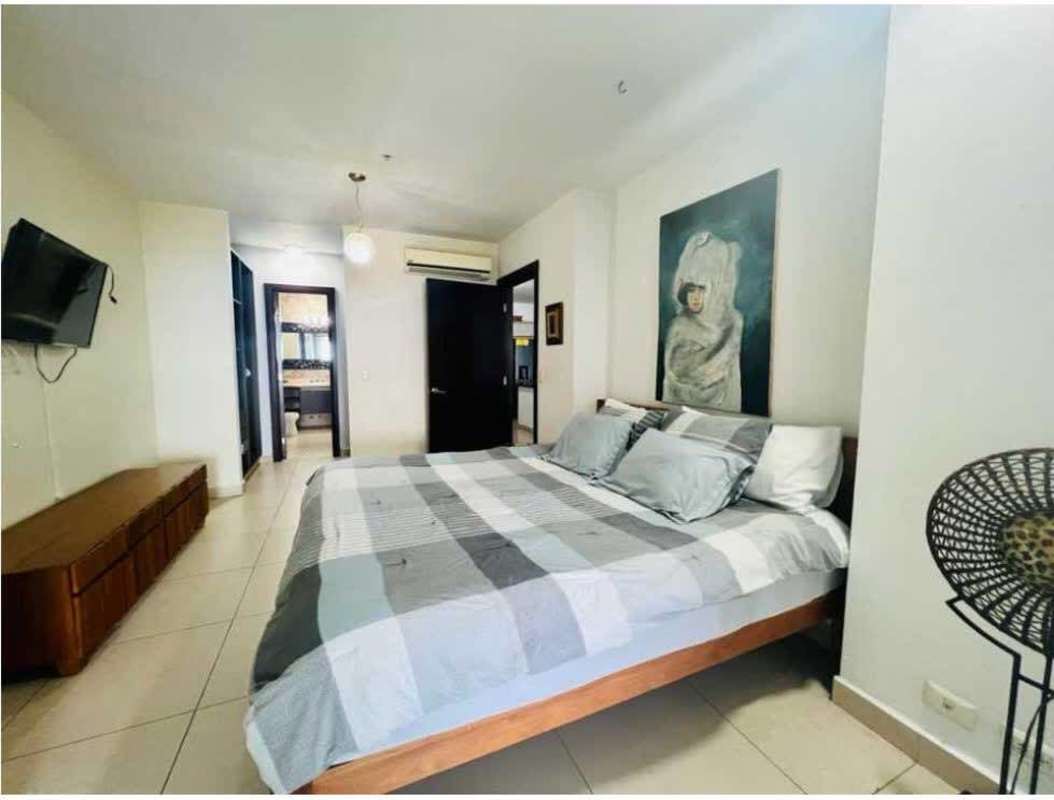 Bedroom with large windows, designer furniture and ocean view terrace in PH Rivage Tower Panama