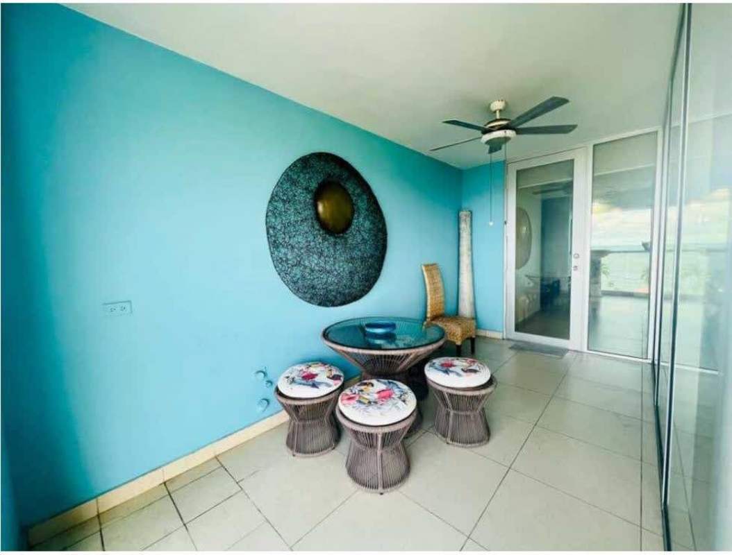 Infinity pool deck with panoramic ocean views and lounge chairs at PH Rivage Tower Avenida Balboa Panama City