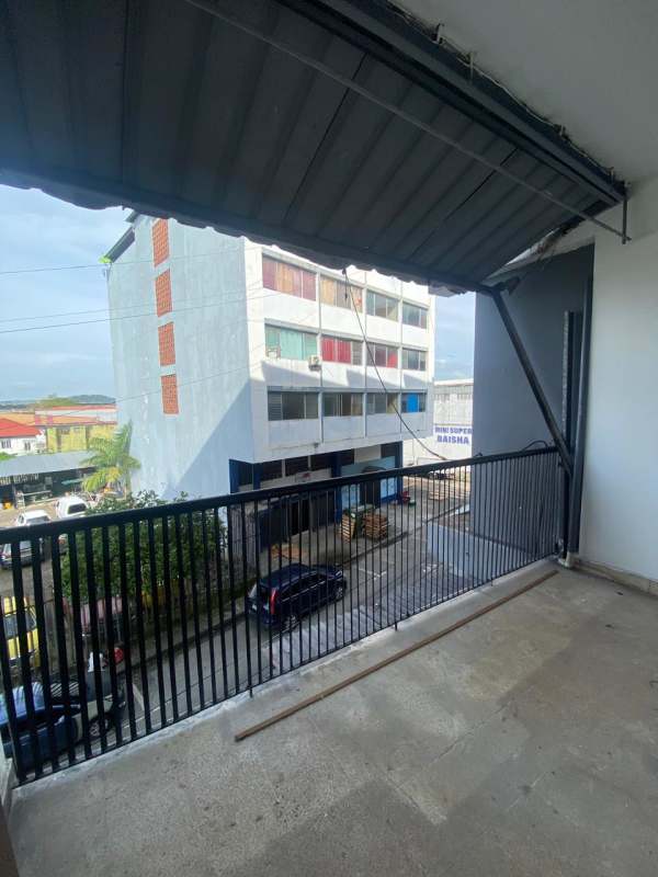 Covered balcony with railing overlooking Calidonia street PH Don Goyo