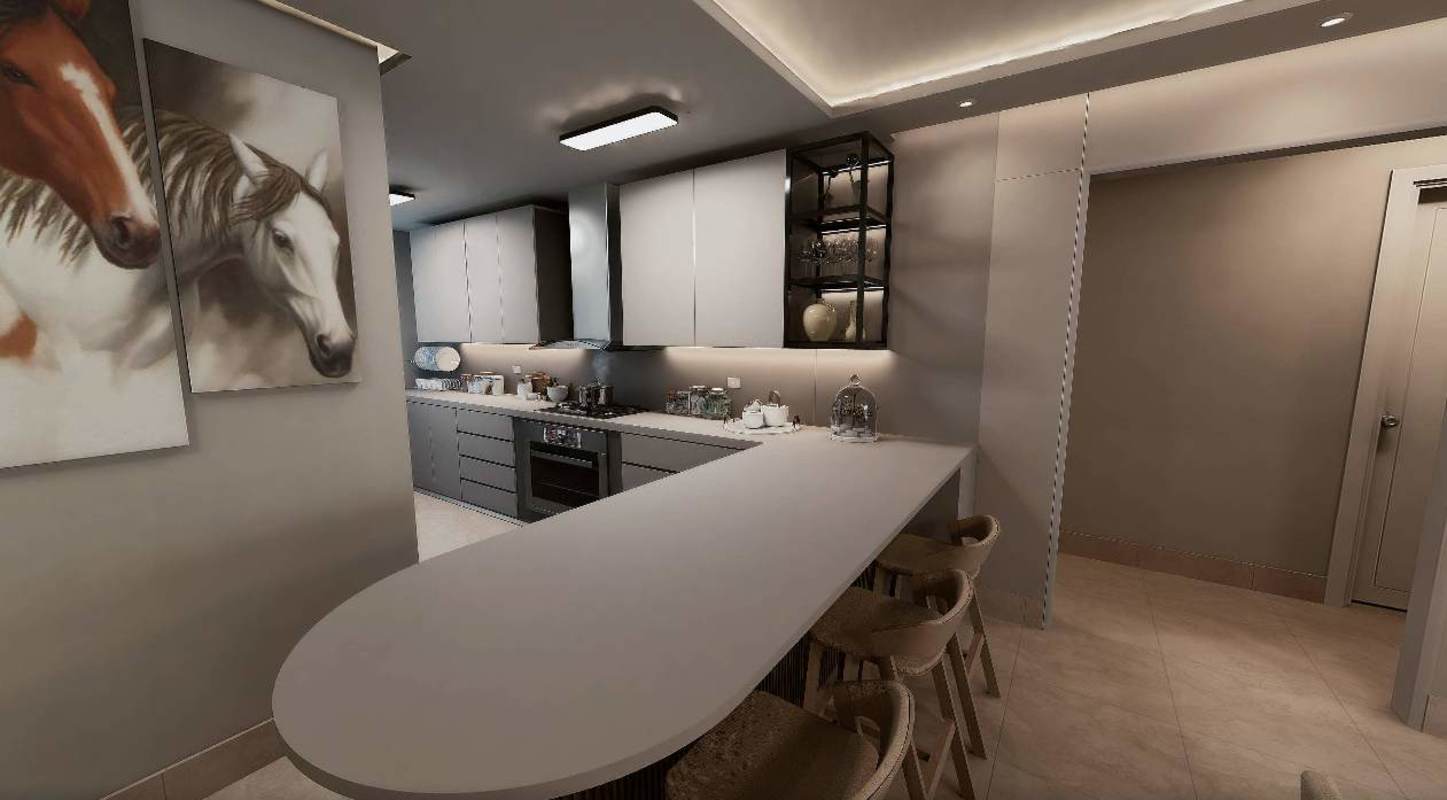 Contemporary kitchen with breakfast island, built-in oven and sleek cabinetry at PH Kai Costa del Este