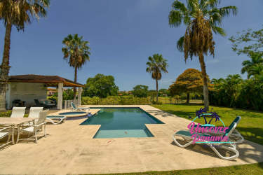 Covered outdoor terrace with tropical garden view at Costa Blanca luxury golf villa in Rio Hato Panama