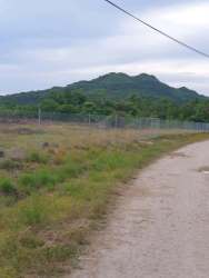 Land lot along dirt road with mountain backdrop in Penonomé Coclé Panama