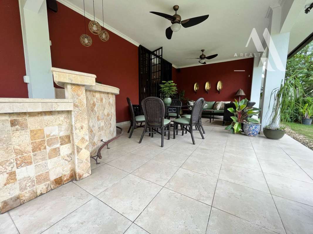 Spacious living room with marble floors, large glass doors in luxury Costa del Este home for rent Panama