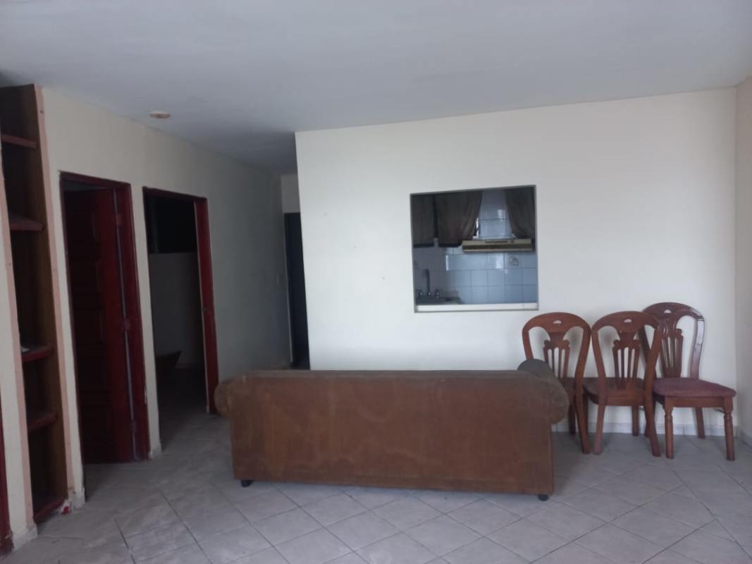 Open living room with tiled floors and natural light in apartment PH Plaza de Trafalgar Carrasquilla Panama