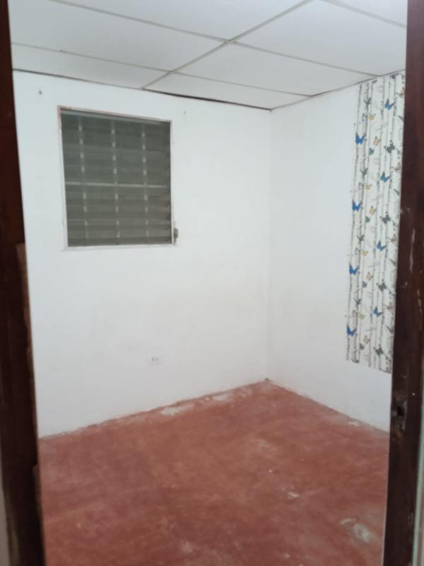 Simple bathroom with walk-in shower, beige tiles and single sink Panama house for sale