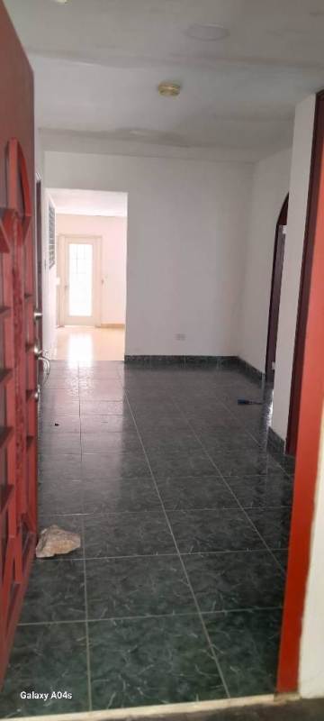 Spacious kitchen with wooden cabinetry, windows and storage Las Cumbres Panama