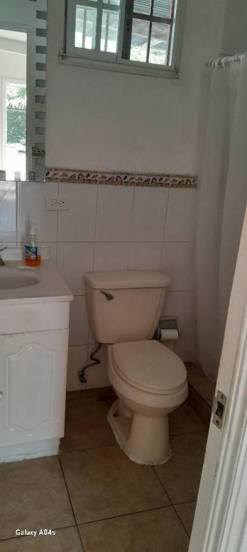 Secure gated entrance paved driveway Las Cumbres suburb house Panama for sale