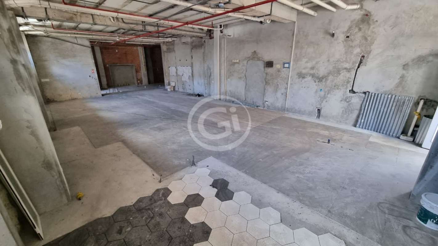 Interior of large unfinished commercial space with tall ceilings and exposed walls Casco Viejo Panama