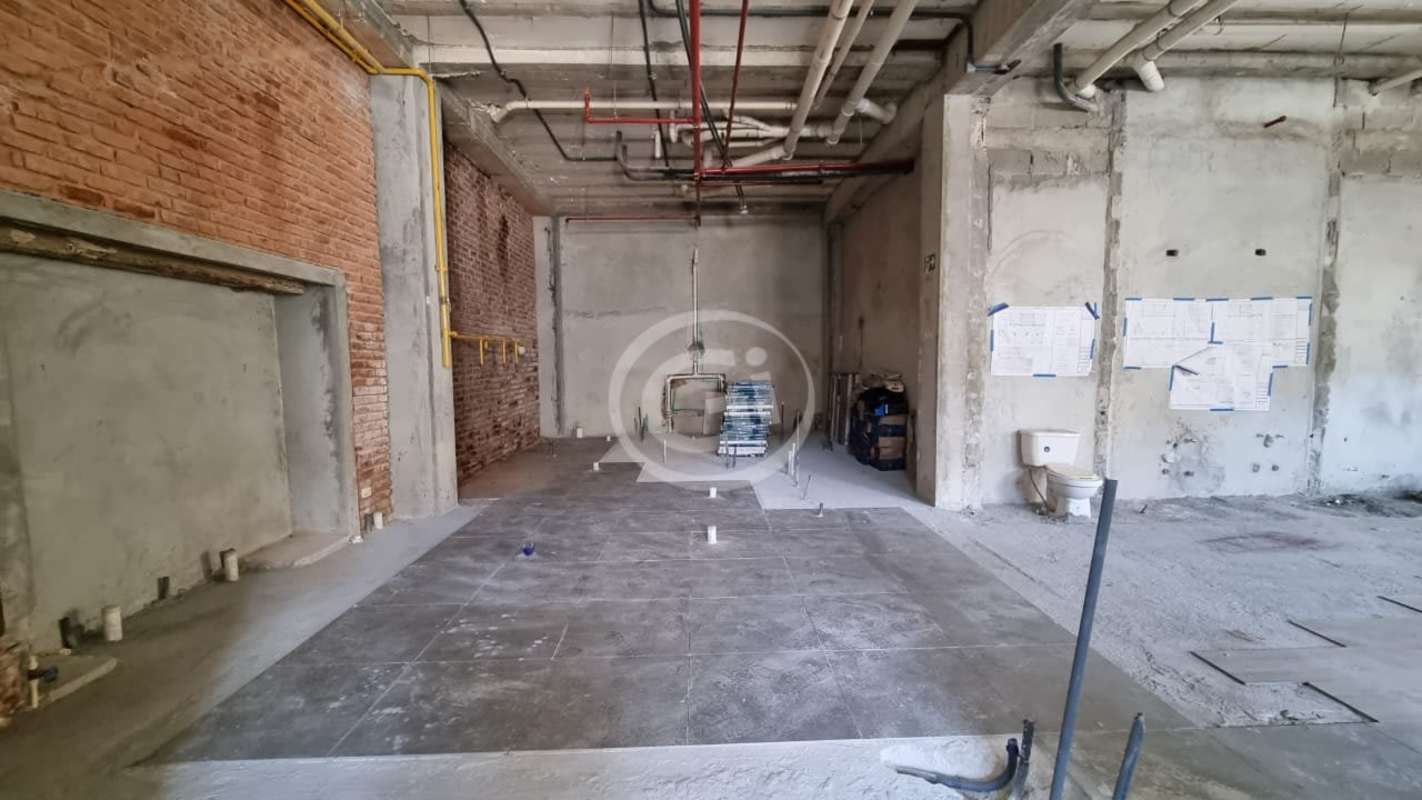 Bright interior with multiple glass doors in corner commercial space under renovation Casco Viejo